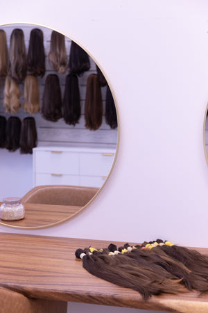 Raw hair bundles on the grading table in the Euro Hair Supply studio
