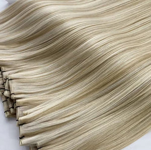 Folded machine weft bundles in soft blonde waves — wholesale European hair